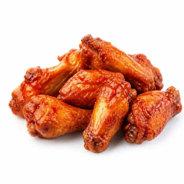 Sauced chicken wings in a serving basket